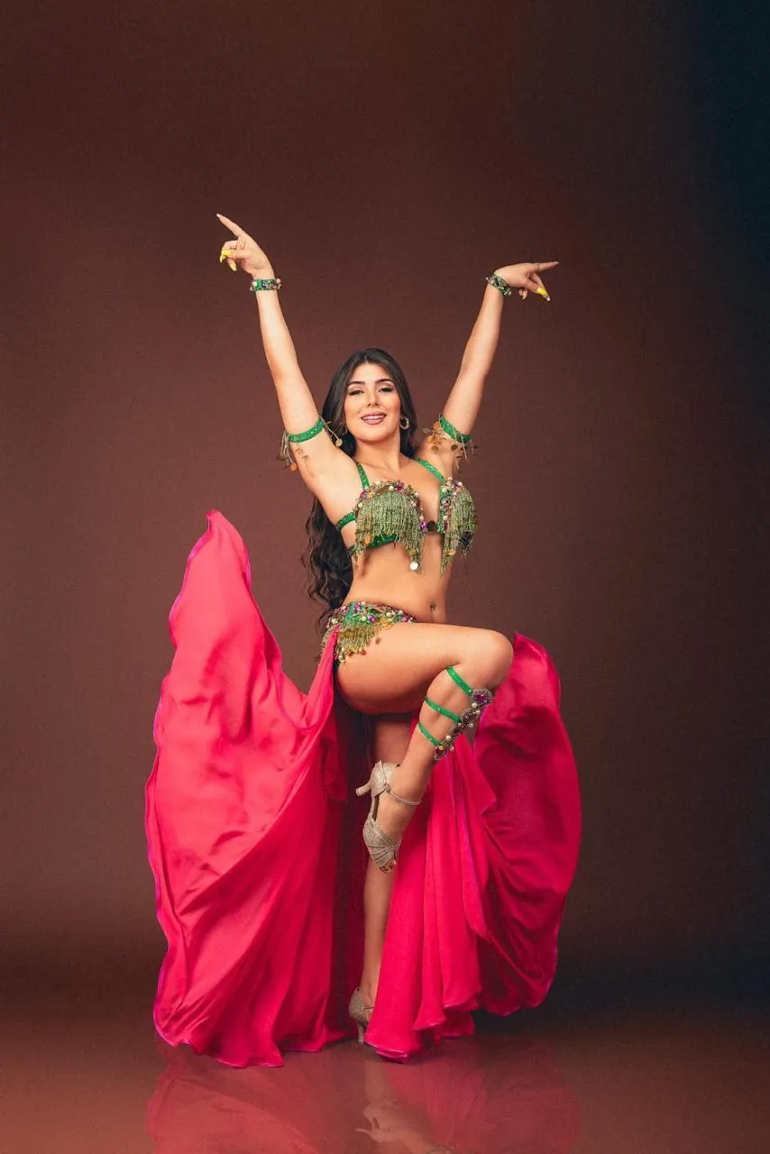Belly dancer in a pink and green costume