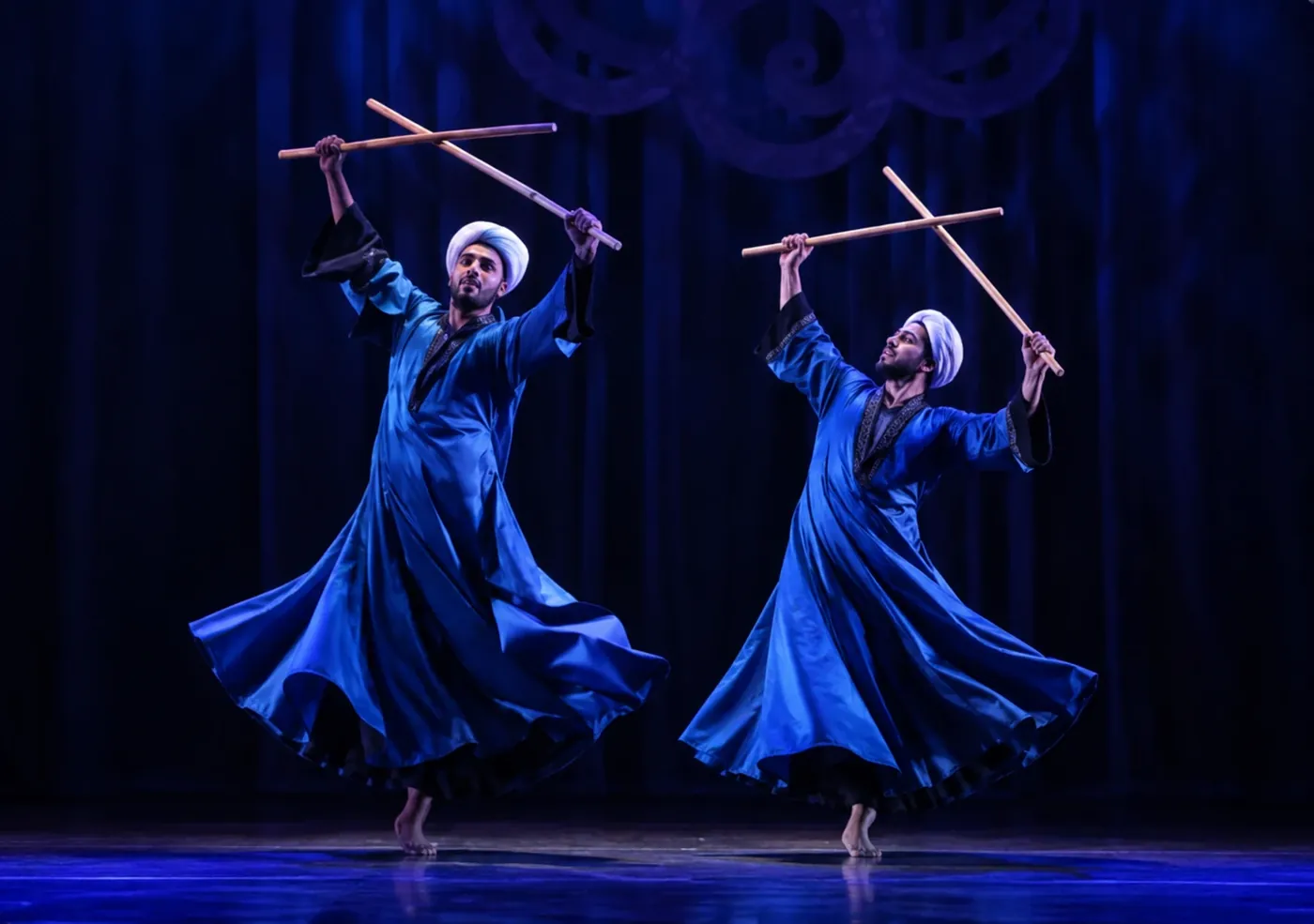 Saidi folklore dancers with sticks in blue robes