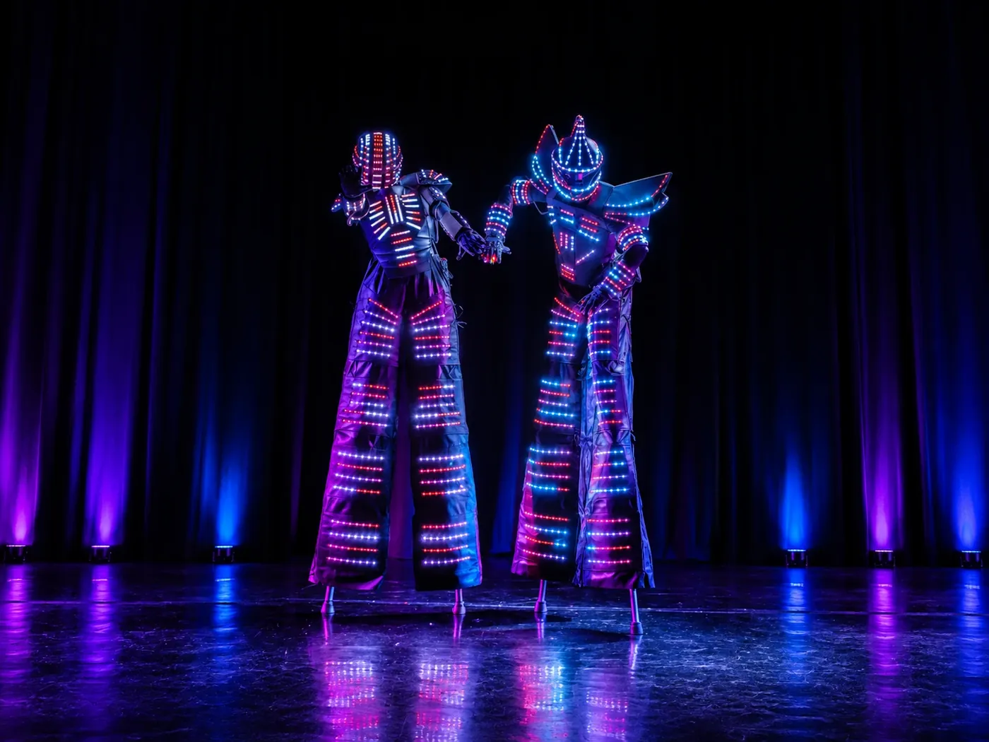 LED stilt robots on stage