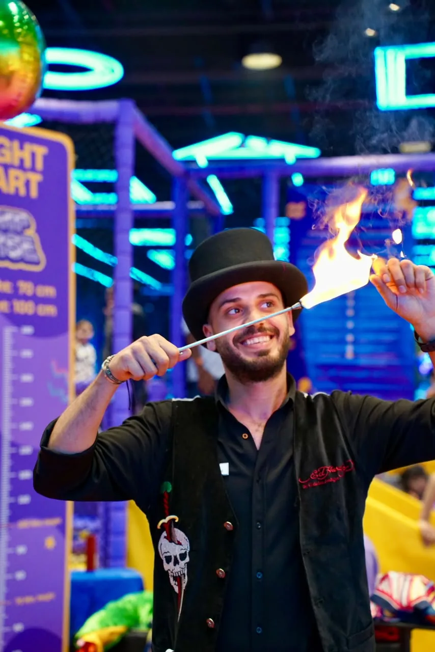 Magician in a top hat performing a magic trick